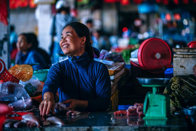 Midsection of woman at market stall