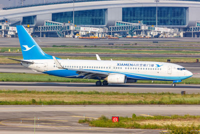 View of airplane at airport runway