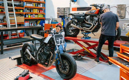 Low section of man riding motorcycle