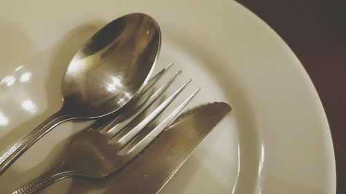 Close-up of silverware on plate