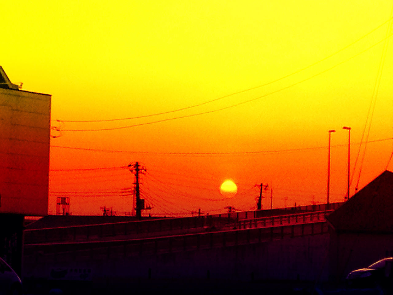 sunset, orange color, power line, connection, cable, electricity pylon, electricity, power supply, sky, transportation, built structure, architecture, silhouette, building exterior, clear sky, low angle view, technology, yellow, power cable, no people