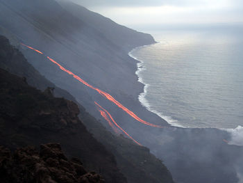 High angle view of stromboli volcano by sea