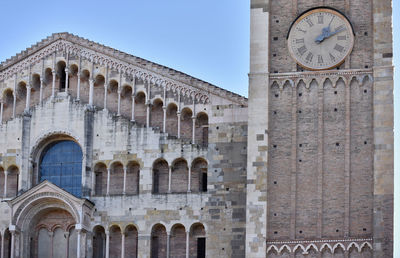 Low angle view of clock tower against sky