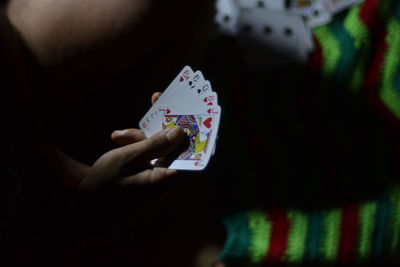 Cropped image of hand holding guitar