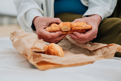 Midsection of man holding food