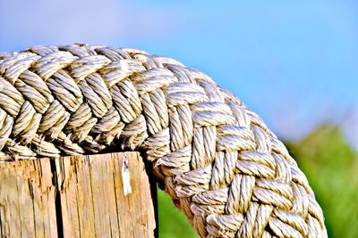 Close-up of rope tied on wooden post