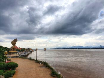 Scenic view of sea against storm clouds