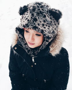 Close-up of beautiful woman in warm clothing during winter