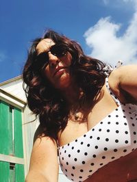 Low angle view of woman against sky