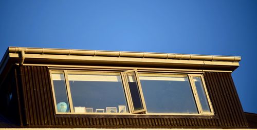 Low angle view of built structure against blue sky