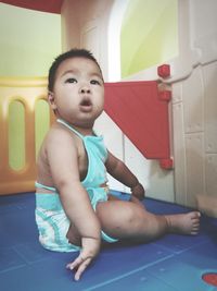 Cute boy playing at home