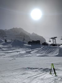 Scenic view of snow covered mountain against sky