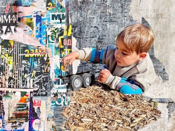 High angle view of boy playing with toy