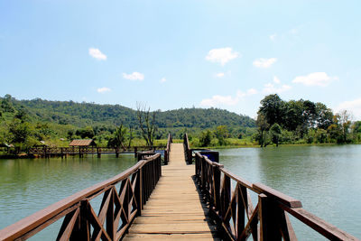 Pier over lake against sky