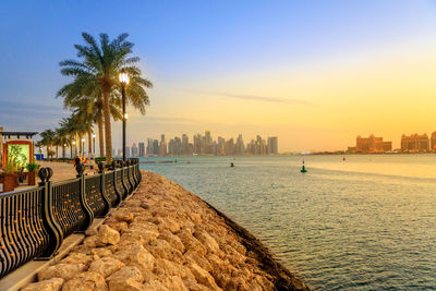 Scenic view of beach against sky during sunset