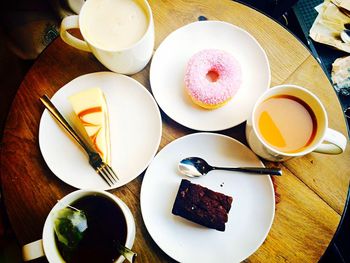 High angle view of desserts and coffee on table