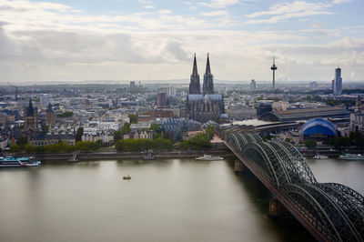 Bridge over river with buildings in background