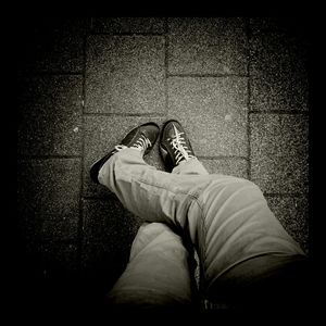 Low section of woman standing on tiled floor