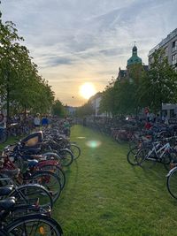 Bicycles against sky during sunset