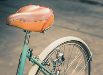 Cropped image of bicycle on street