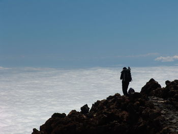 Man standing on rock formation