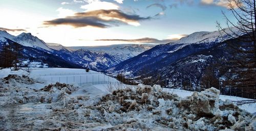 Scenic view of snowcapped mountains against sky