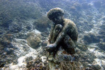 Zodiac statue underwater