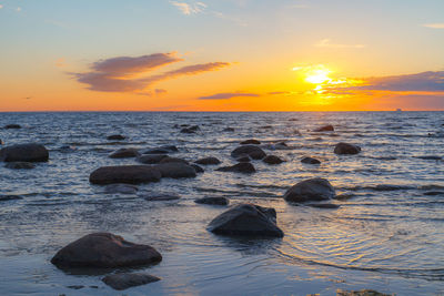 Scenic view of sea against sky during sunset