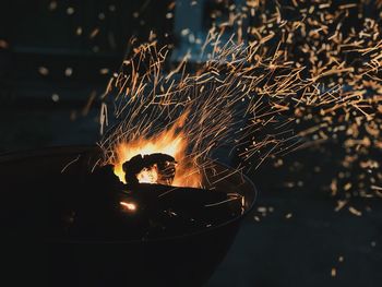 Sparks emitting from fire at night