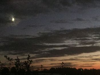 Scenic view of silhouette landscape against sky at night