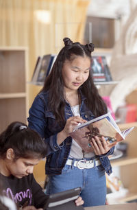 Teenage girl reading book