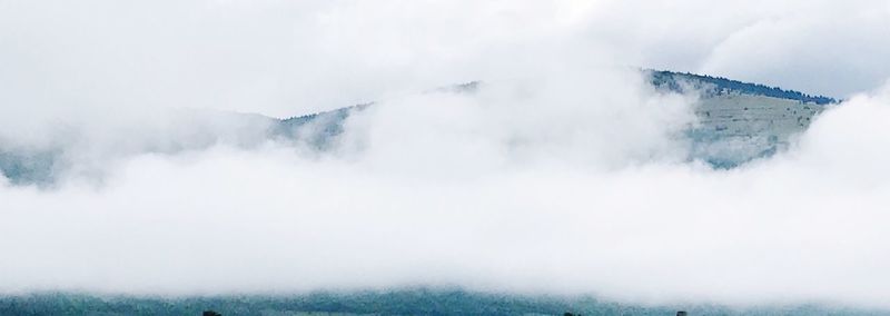 Scenic view of mountains against sky during winter