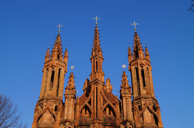 Low angle view of a temple building against blue sky