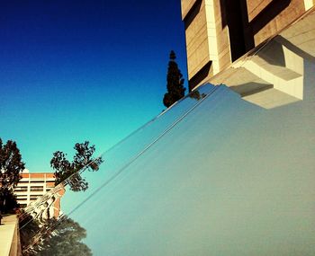 Low angle view of building against blue sky