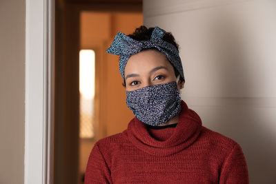 Close up of confident black brazilian woman with protective mask and headband. 