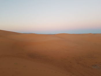 Scenic view of desert against clear sky