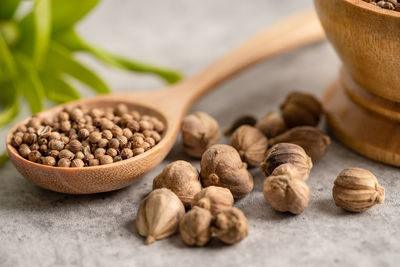 Close-up of roasted coffee beans on table