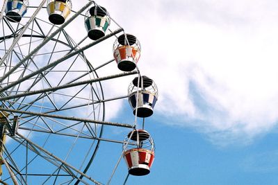 Low angle view of ferris wheel against sky