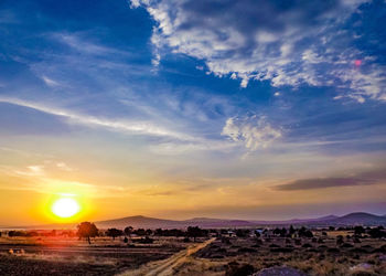 Scenic view of landscape against sky during sunset