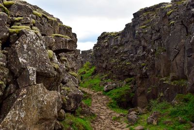 Low angle view of rock formation against sky