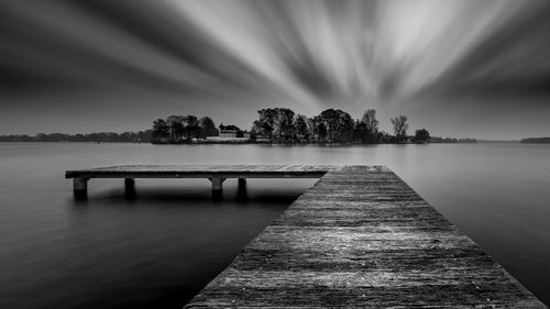 Pier over sea against sky