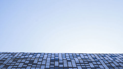 Low angle view of modern building against clear sky