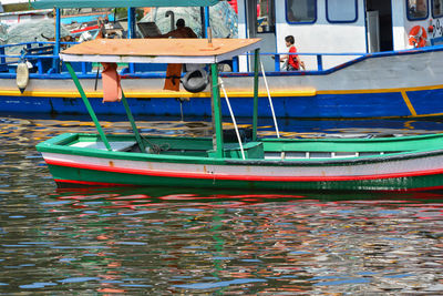 Fishing boats moored in sea