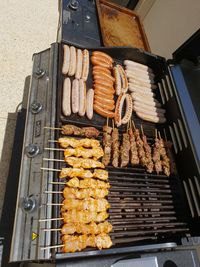 High angle view of meat on barbecue grill