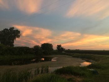 Scenic view of landscape against sky during sunset
