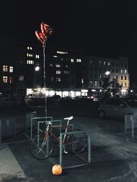 Cars parked in city at night