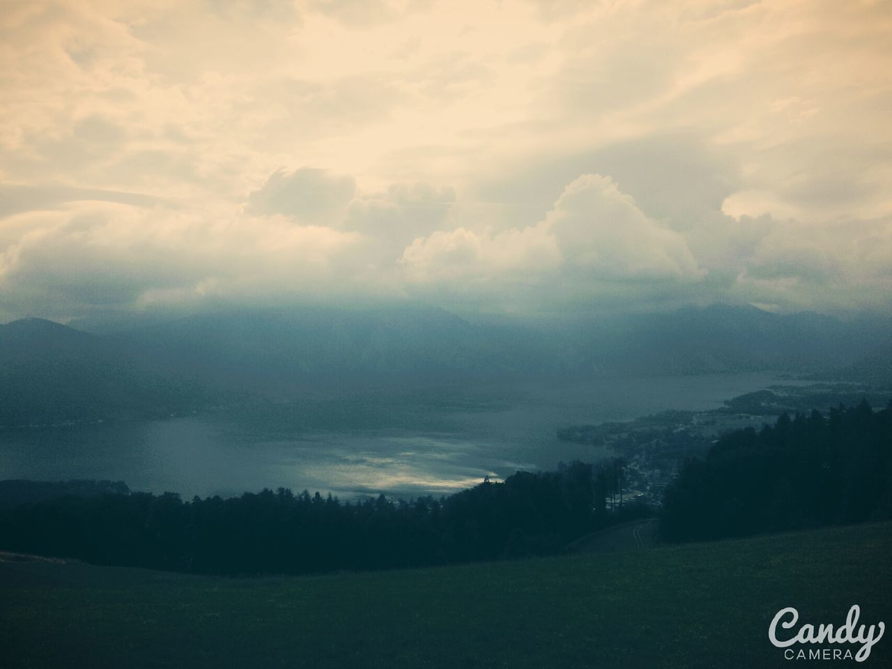 tranquil scene, scenics, sky, tranquility, landscape, beauty in nature, mountain, cloud - sky, tree, nature, weather, non-urban scene, cloudy, idyllic, outdoors, no people, cloud, day, field, mountain range