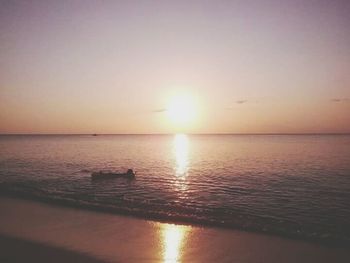 Scenic view of sea against sky at sunset