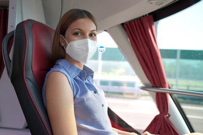 Portrait of beautiful woman in car