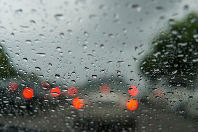 Raindrops on glass window during rainy season